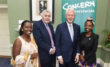 Left to Right: Marie-Ange Beriman, Concern CEO Dominic MacSorley, President Bill Clinton, Concern's Youth Ambassador Aline Joyce Berabose (daughter of Marie-Ange) at Concern's 50th Anniversary Conference at Dublin Castle