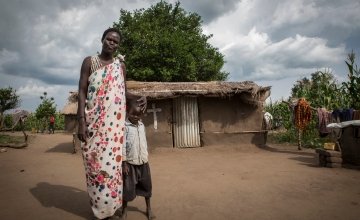 Ayen Duot, 40 years old, with her son Bul Athian in Adjumani, Uganda. Ayen and her children fled Blor, the capital of Jonglei State in South Sudan and now live in a refugee settlement in Uganda. Photo: Panos Pictures / Concern Worldwide.