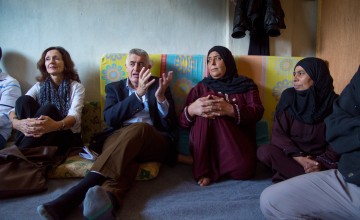 Concern Worldwide CEO Dominic MacSorley and Lebanon Country Director Elke Leidel with residents of a collective center for Syrian refugees in Northern Lebanon. Photo: Kieran McConville