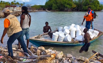 NFI’s are unloading off shore at Grand Vide for a joint distribution between Concern and World Vision. Photo: Peter Doyle/Concern Worldwide.