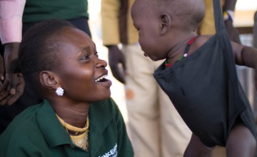 Monica Mawien a supervisor with the Concern community nutrition team pictured with 14 month old Anger Adim Garang, a twin who was admitted to Concern’s outpatient therapeutic programme in Maduany in Aweil North, South Sudan. Photo: Kieran McConville/Concern Worldwide.