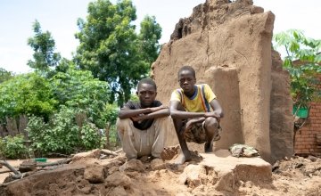 Brothers, Charity Raphael (16) and Fraction Raphael (14) standing on what's left of their home. Their home was washed away with all their belongings. Photo: Gavin Douglas/Concern Worldwide