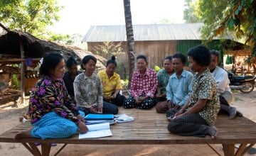 Local villagers attend a monthly Self Help Group set up by SORF (Concern's local NGO partner) in Pursat, Cambodia. Photo: Conor Wall / Concern Worldwide.