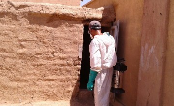 A member of Concern's pest control team in Syria, spraying a building in order to control the spread of pests and insects. Photo: Concern Worldwide.