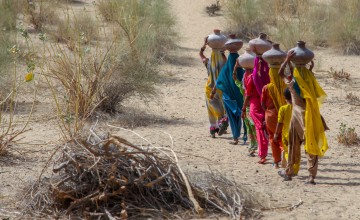 Community women carrying water in mud pots from the communal well  Umerkot district Sindh province Pakistan  April 2017  (00000003).jpg