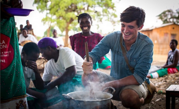 Food writer, photographer and TV presenter Donal Skehan with 'lead mothers' who are trained by Concern Wolrdwide on nutrition and teach women in the Kachere Care Group about how to make a nutritious meal for their families with five major food groups. Location: Kaigwanga Village, Mchinji, Malawi. Photo: Jennifer Nolan / Concern Worldwide.