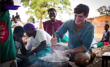 Food writer, photographer and TV presenter Donal Skehan with 'lead mothers' who are trained by Concern Wolrdwide on nutrition and teach women in the Kachere Care Group about how to make a nutritious meal for their families with five major food groups. Location: Kaigwanga Village, Mchinji, Malawi. Photo: Jennifer Nolan / Concern Worldwide.