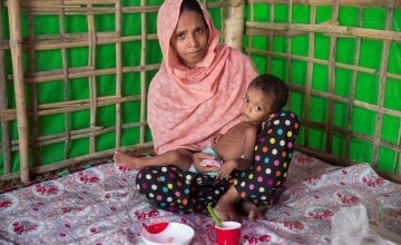 Layru (25) and Hala (two years old) at Concern Worldwide's nutrition support centre at Hakim Para camp in Cox's Bazar, Bangladesh. Photo: Kieran McConville/Concern Worldwide.