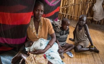 Nadia with three of her children on the island of Touch Riak where they have sought refuge from violence. South Sudan, March 2017. Photo: Kieran McConville, Concern Worldwide.