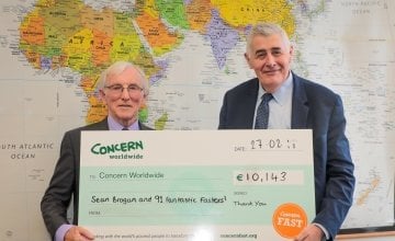 Cavan native Sean Brogan with Concern Worldwide CEO Dominic MacSorley at Concern's Dublin headquarters presenting his cheque for €10,143