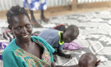 Little Maria Abuk with her mother Athieng Makuac, while attending their second check-up at Concern's OTP site in Aweil North, South Sudan