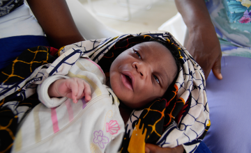 A newborn baby boy at the Community Care Center in John Logan Town, Grand Bassa, Liberia built by Concern Worldwide. Photo taken by Kieran McConville, 2015.