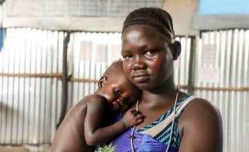 South Sudanese refugee Nyakoun Tut with her son Thujin after he was treated for malnourishment by Concern Worldwide at a refugee camp in Gambella, Ethiopia