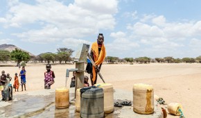 Children pump water at a tap in Kangalita., Kenya. The region has been severely affected by drought. Photo: Natalia Jidovanu/Concern Worldwide.