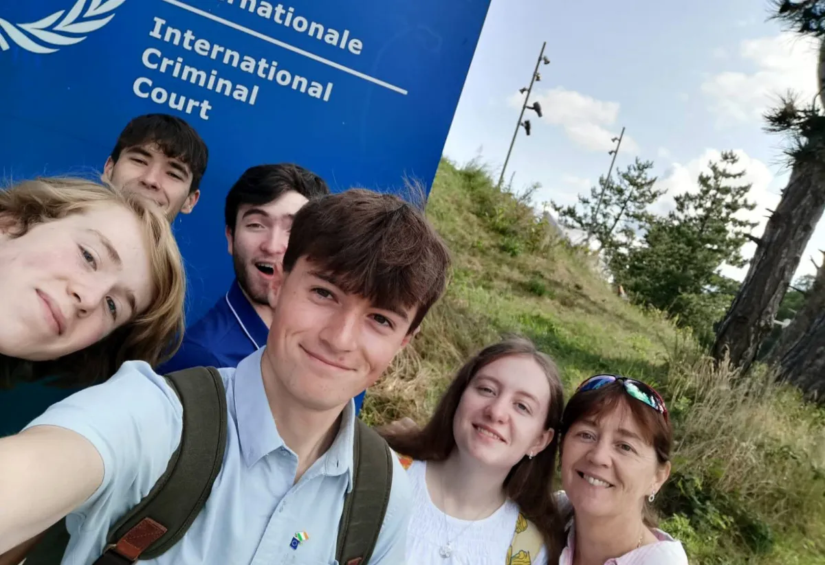 Students smile at the camera