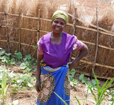 Farmer Eliza John Wesele standing in her home garden