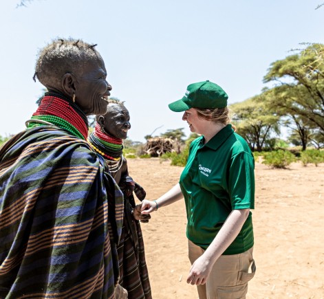 Concern's Youth Climate Ambassador Dearbhla Richardson shakes hands with two women from Kangalita Irrigation scheme