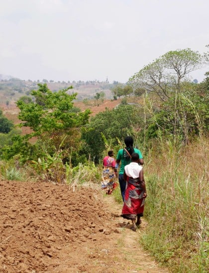 Concern staff and members of the Sayamika Catchment Conservation Group walk through the fields of Samu village