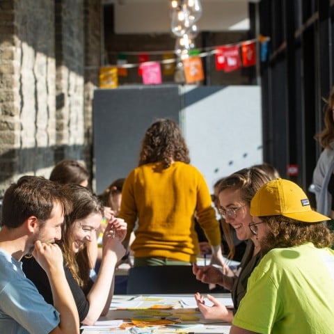 Group of students discuss Sustainable Development Goals at table