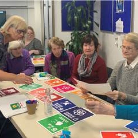 Discussion between group of six people about Sustainable Development Goals