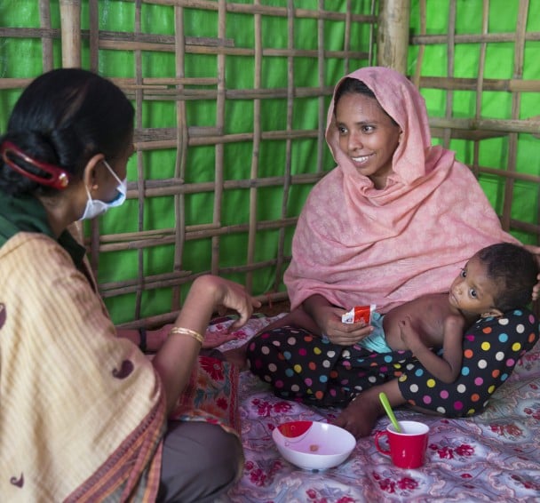 Two year old Hala is assessed by staff at Concern's nutrition centre in Cox's Bazar, Bangladesh. Photo: Kieran McConville / Concern Worldwide.