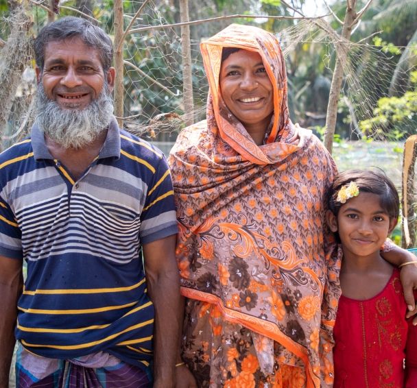 Asma with her husband Abdul and her daughter Maria on their farm in Bangladesh. 