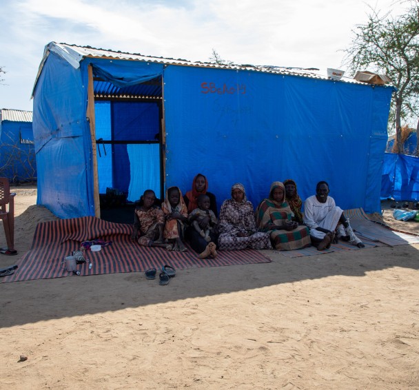 Alafia*'s family outside their home in refugee camp in Eastern Chad