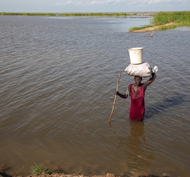 Nyakeok Top Leny (56) returns from harvesting water lilies in the flooded waters of Bentiu, South Sudan. (Photo: Eugene Ikua/Concern Worldwide)