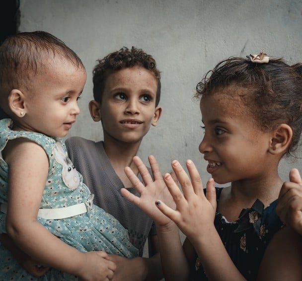 Rima playing with children in Al-Shaqa'a village