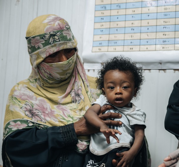 Basam* receiving a follow-up check-up 