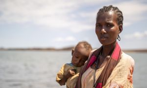 A Kenyan mother with her son in El Molo Bay, Marsabit