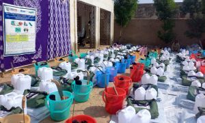 Rows of buckets, water cans and hygiene supplies