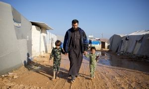 Man with children in Syria