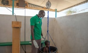 A child is weighed at the Concern health post in Baga Sola, Western Chad. Photo: Eugene Ikua/Concern Worldwide