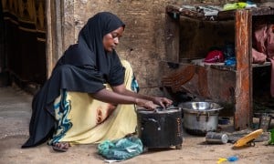 Idil* a mother of seven children, sells clothes and shoes in Wadajir district. Through a self-help group, she was able to enrol in various training programmes for business and household management, including improving how to solve household issues as a couple. The business training taught her how to read and write, as well as how to do maths and calculate her earnings. Photo: Mustafa Saeed/Concern Worldwide