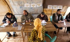 Members of the Syria Relief team deliver the cash vouchers to people affected by the February 2023 earthquake. (Photo: Ali Haj Suleiman/DEC/Fairpicture)