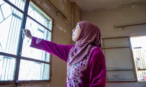 Darine* and her husband want to move where her kids can get an education. Concern has put windows in their apartment to help keep the cold out. (Photo: Gavin Douglas/Concern Worldwide)