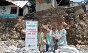 Dry food ration items are distributed to flood affected community members in Pakistan