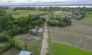 A four-foot-high, 2,241-foot-long flood-resilient road now bridges the east and west of Vati Kapasia, Bangladesh. The raised road, a lifeline for the local community, was constructed in July 2024 by Gana Unnayan Kendra with support from Concern Worldwide and funded by the Z Zurich Foundation”. Photo: Saikat Mojumder/Concern Worldwide