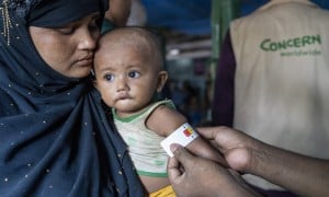 Ayesha*&#039;s malnourished child Anwar* is measured by a Concern health worker in the nutrition center at Camp 13, Cox&#039;s Bazar. (Photo: Saikat Mojumder/Concern Worldwide)