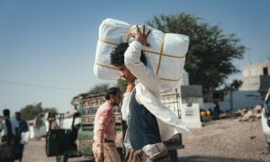 The Concern team distributing shelter materials to people affected by the sandstorm that struck Al Anad IDP Camp, Tuban District, Yemen.