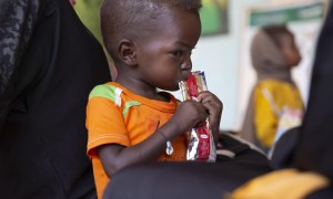 Jamal eats therapeutic food at a nutrition clinic, supported by Concern Worldwide,  in Ardamata, just outside El Geneina, Sudan. Jamal* is severely acutely malnourished.