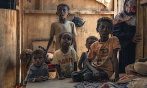 A family in their shelter in one of the displacement camps in Tuban district, where Concern provides health and nutrition services. Photo: Concern Worldwide