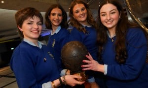 Four people from Ursuline Secondary School holding a trophy after winning Concern Debate final 2026
