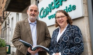Concern Worldwide Chief Executive Officer Dominic Crowley and Chair Rosalyn Tamming with the 2025 Annual Report. Photo: Jon Hozier-Byrne/Concern Worldwide
