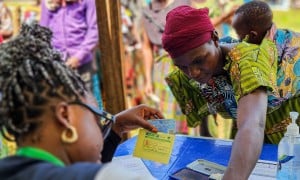 Participants are registered at the verification desk before proceeding to the distribution points. Photo: Samuel Isenge/Concern Worldwide