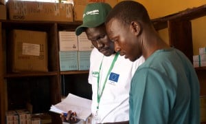 Health and Nutrition Manager Luka Malek Mur and Health Facility Officer checking registers in Northern Bahr al Ghazal, South Sudan. Photo: Hannah Bolder/Concern Worldwide