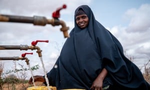Local farmer Luul Ahmed collecting water at Bula Qalooc, Dolow District, Gedo region, southwestern Somalia