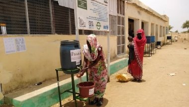 To help reduce the spread of Covid-19 beneficiaries wash hands before entering Concern supported Nutrition Facility in West Darfur.