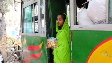 Sakuma* sells sweets and chocolates on crowded buses in Dhaka to save money for her brother's education. Sakuma* (14) and her brother Kassim* are supported by a Concern run pavement dweller center, Ananda Bazar, Dhaka. Having lived on the street most of her life, she lost her mother to illness and her father was a drug addict when a worker from the pavement dweller center found her. They both now live in the pavement dweller center and receive a host of supports from Concern including shelter, food, educati